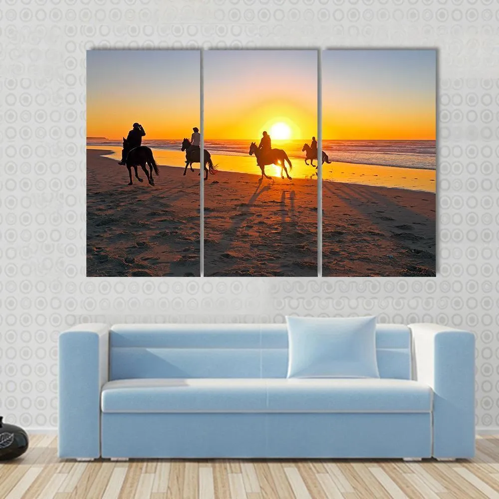 Horse Riding On Beach At Sunset Canvas Wall Art