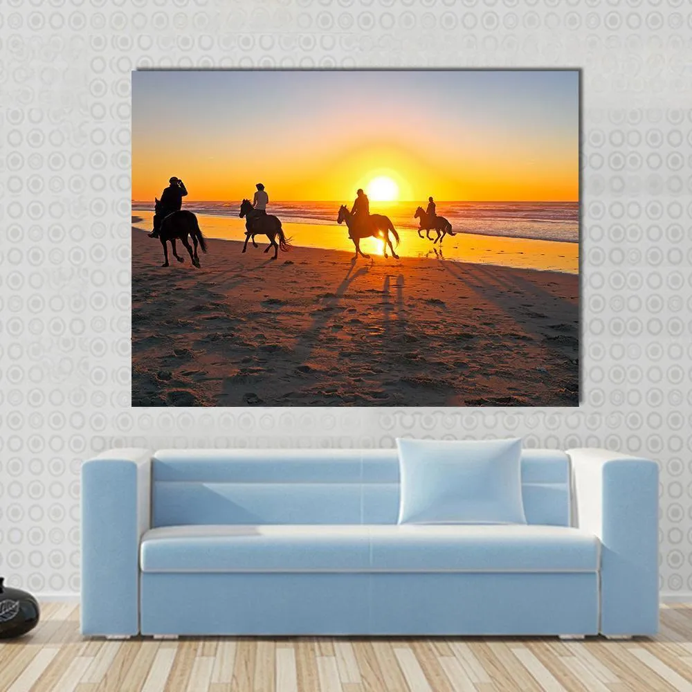 Horse Riding On Beach At Sunset Canvas Wall Art